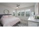 Bright bedroom with multiple windows offering neighborhood views at 154 Stella Ln # A, Troutman, NC 28166