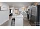 Well-lit kitchen featuring stainless steel appliances, quartz countertops, and access to a bedroom at 154 Stella Ln # A, Troutman, NC 28166