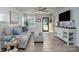 Cozy living room featuring a comfortable sofa, modern decor, and a yellow front door at 154 Stella Ln # A, Troutman, NC 28166