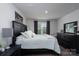 Bedroom with dark wood furnishings, a large window, and a view of the outside at 154 Stella Ln # A, Troutman, NC 28166