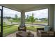 Inviting sunroom with outdoor view and cozy wicker seating at 154 Stella Ln # A, Troutman, NC 28166