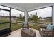 Inviting sunroom with outdoor view and cozy wicker seating at 154 Stella Ln # A, Troutman, NC 28166