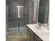 Well-lit bathroom features double sinks, a glass-enclosed shower with seating, and modern fixtures at 1598 Respect St, Concord, NC 28027