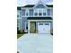 Charming two-story home with a gray color scheme and a white garage door with modern appeal at 1598 Respect St, Concord, NC 28027