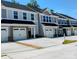 Modern townhome exteriors with attached garages and contemporary design, showcasing curb appeal and convenient parking at 1598 Respect St, Concord, NC 28027