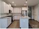 Modern kitchen features granite countertops, stainless steel appliances, and a large island at 1598 Respect St, Concord, NC 28027