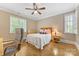 Inviting bedroom with natural light, comfortable furniture, and stylish decor for a relaxing retreat at 1728 Shadow Forest Dr, Matthews, NC 28105