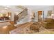 Home entryway showcasing a staircase, hardwood floors, and access to the living and dining areas at 1728 Shadow Forest Dr, Matthews, NC 28105