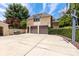 Three car garage with a large driveway and a basketball hoop at 1728 Shadow Forest Dr, Matthews, NC 28105