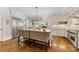 Open kitchen featuring a large island with seating, modern appliances, and white cabinetry at 1728 Shadow Forest Dr, Matthews, NC 28105
