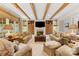 Spacious living room featuring beamed ceilings, built-in shelving, and comfortable seating at 1728 Shadow Forest Dr, Matthews, NC 28105