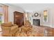 Cozy living room featuring armchairs, a fireplace with a marble mantel, and natural light at 1728 Shadow Forest Dr, Matthews, NC 28105
