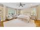 Spacious main bedroom featuring neutral tones, natural light, plush carpet, and elegant furnishings at 1728 Shadow Forest Dr, Matthews, NC 28105