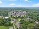 Vibrant aerial view captures the town center, surrounded by lush trees and a clear sky with distant hills at 206 Charlotte St, York, SC 29745