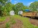 Manicured backyard with shed and car port, and manicured garden at 206 Charlotte St, York, SC 29745
