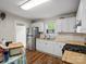 Bright kitchen featuring white cabinets, stainless steel appliances, and butcher block countertops at 206 Charlotte St, York, SC 29745