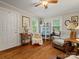 Comfortable living room featuring hardwood floors, bright windows, and neutral decor, perfect for relaxation and entertaining at 206 Charlotte St, York, SC 29745
