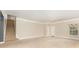 Spacious carpeted basement featuring a staircase, multiple doors, and a large window at 237 Lylic Woods Dr, Fort Mill, SC 29715