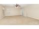 Spacious bedroom features a ceiling fan and neutral carpet and paint at 237 Lylic Woods Dr, Fort Mill, SC 29715