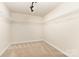 Large walk-in closet with carpet and shelving for organization at 237 Lylic Woods Dr, Fort Mill, SC 29715