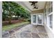 Outdoor patio with stone tile and a ceiling fan, perfect for relaxing at 237 Lylic Woods Dr, Fort Mill, SC 29715