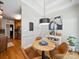 Charming breakfast nook featuring a stylish light fixture, modern artwork, and a coffee bar at 2616 Carmarthen Ct, Matthews, NC 28104