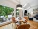Bright breakfast nook with backyard view, featuring modern lighting and cozy seating at 2616 Carmarthen Ct, Matthews, NC 28104