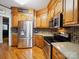 Well-equipped kitchen features stainless steel appliances, granite countertops, and wooden cabinetry at 2616 Carmarthen Ct, Matthews, NC 28104