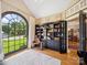 Bright living room features a comfortable sofa, unique windows, and calming decor at 2616 Carmarthen Ct, Matthews, NC 28104