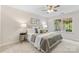 Relaxing bedroom featuring a ceiling fan, comfortable bedding, and lots of natural light at 3008 Cornflower Ln, Indian Trail, NC 28079