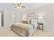 Comfortable bedroom featuring a ceiling fan, comfortable bedding, and lots of natural light at 3008 Cornflower Ln, Indian Trail, NC 28079