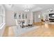 Bright dining room boasts hardwood floors, modern chandelier, and stylish decor at 3008 Cornflower Ln, Indian Trail, NC 28079