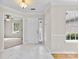 Inviting foyer features elegant marble floors, white trim, and lots of natural light at 3008 Cornflower Ln, Indian Trail, NC 28079