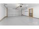 View of the clean and spacious two-car garage with epoxy flooring and an automatic door opener at 3008 Cornflower Ln, Indian Trail, NC 28079
