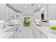 Bright, all-white kitchen with modern appliances, marble countertops, and an open layout at 3008 Cornflower Ln, Indian Trail, NC 28079