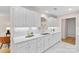 A beautifully designed kitchen with white cabinets, light countertops, and stainless steel appliances at 3008 Cornflower Ln, Indian Trail, NC 28079