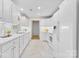Spacious white kitchen featuring modern appliances, ample storage, and stylish marble floors at 3008 Cornflower Ln, Indian Trail, NC 28079