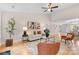 Bright living room with a fireplace, hardwood floors, and an open concept layout at 3008 Cornflower Ln, Indian Trail, NC 28079