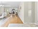 Open floor plan showcasing hardwood flooring throughout dining, living, and entryway at 3008 Cornflower Ln, Indian Trail, NC 28079