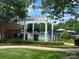 Outdoor community pool area featuring a pergola, and manicured landscaping, providing a relaxing atmosphere at 3008 Cornflower Ln, Indian Trail, NC 28079