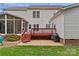 Home exterior featuring a wood deck, patio and screened porch, perfect for enjoying the outdoor space at 3830 Waters Reach Ln, Indian Trail, NC 28079