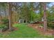 The backyard offers a storage shed, hammock, bench, and plenty of privacy at 3830 Waters Reach Ln, Indian Trail, NC 28079