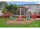 The backyard features a fire pit surrounded by chairs, creating an inviting outdoor space at 3830 Waters Reach Ln, Indian Trail, NC 28079
