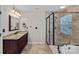 Bathroom showcasing a shower, vanity, and soaking tub at 3830 Waters Reach Ln, Indian Trail, NC 28079