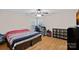 Bedroom with wood floors, ceiling fan, and a window that provides great natural light at 3830 Waters Reach Ln, Indian Trail, NC 28079