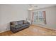 Bedroom with hardwood floors, neutral wall color, and a window at 3830 Waters Reach Ln, Indian Trail, NC 28079