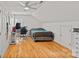 Spacious bedroom featuring hardwood floors, ample natural light, and neutral paint at 3830 Waters Reach Ln, Indian Trail, NC 28079