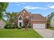 Charming two-story brick home featuring a well-maintained lawn at 3830 Waters Reach Ln, Indian Trail, NC 28079