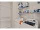 This laundry room provides ample storage space with overhead shelves and side storage at 3830 Waters Reach Ln, Indian Trail, NC 28079