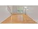 Bright living room featuring hardwood floors and large windows at 3830 Waters Reach Ln, Indian Trail, NC 28079